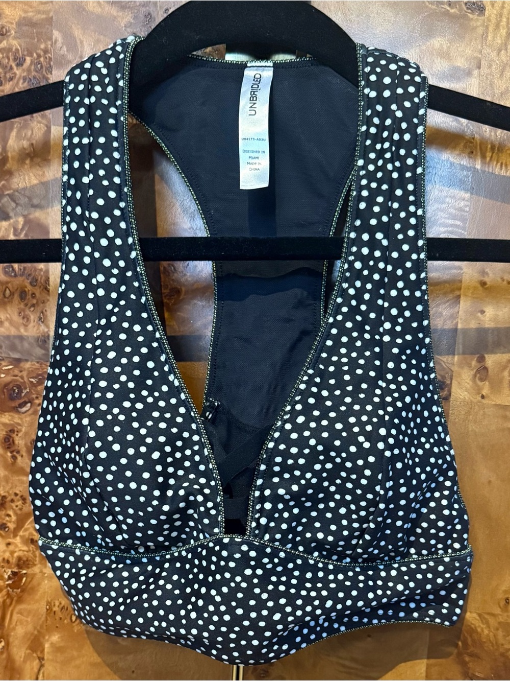 Unbridled Black & White Polka Dot Racerback Sports Bra